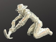 Miner Kneeling Picking